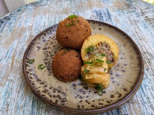 Sausage Stuffed Hush Puppies with Creole Honey Butter