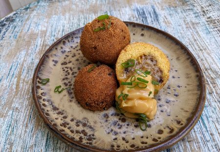 Sausage Stuffed Hush Puppies with Creole Honey Butter