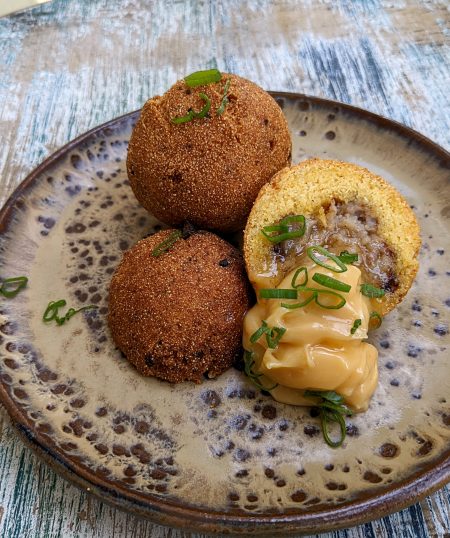 Sausage Stuffed Hush Puppies with Creole Honey Butter