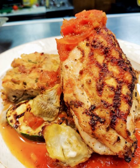 Italian Chicken Breast with Creole Tomato Sauce and Artichoke Bread Pudding